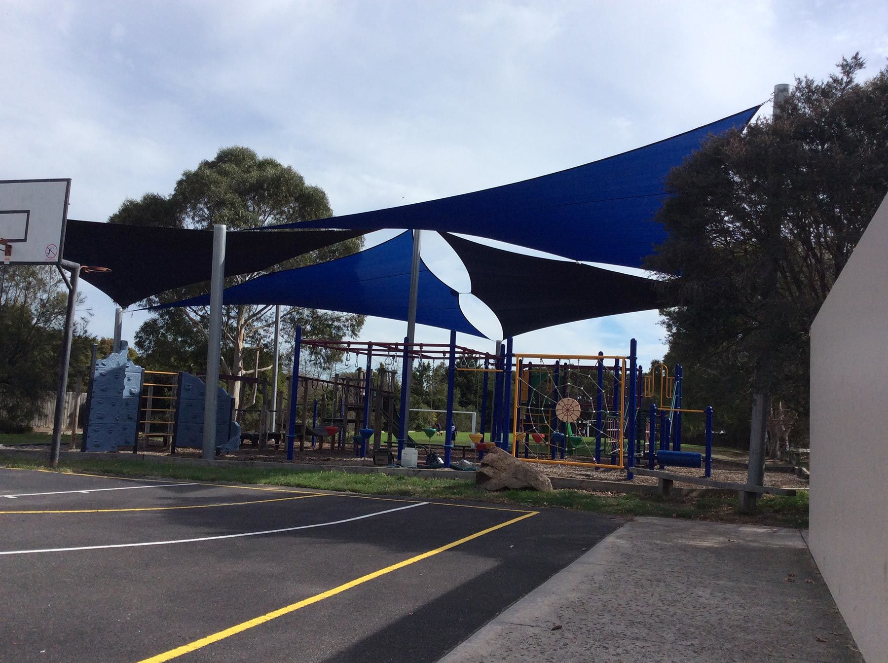 Multiple large shade sails in school