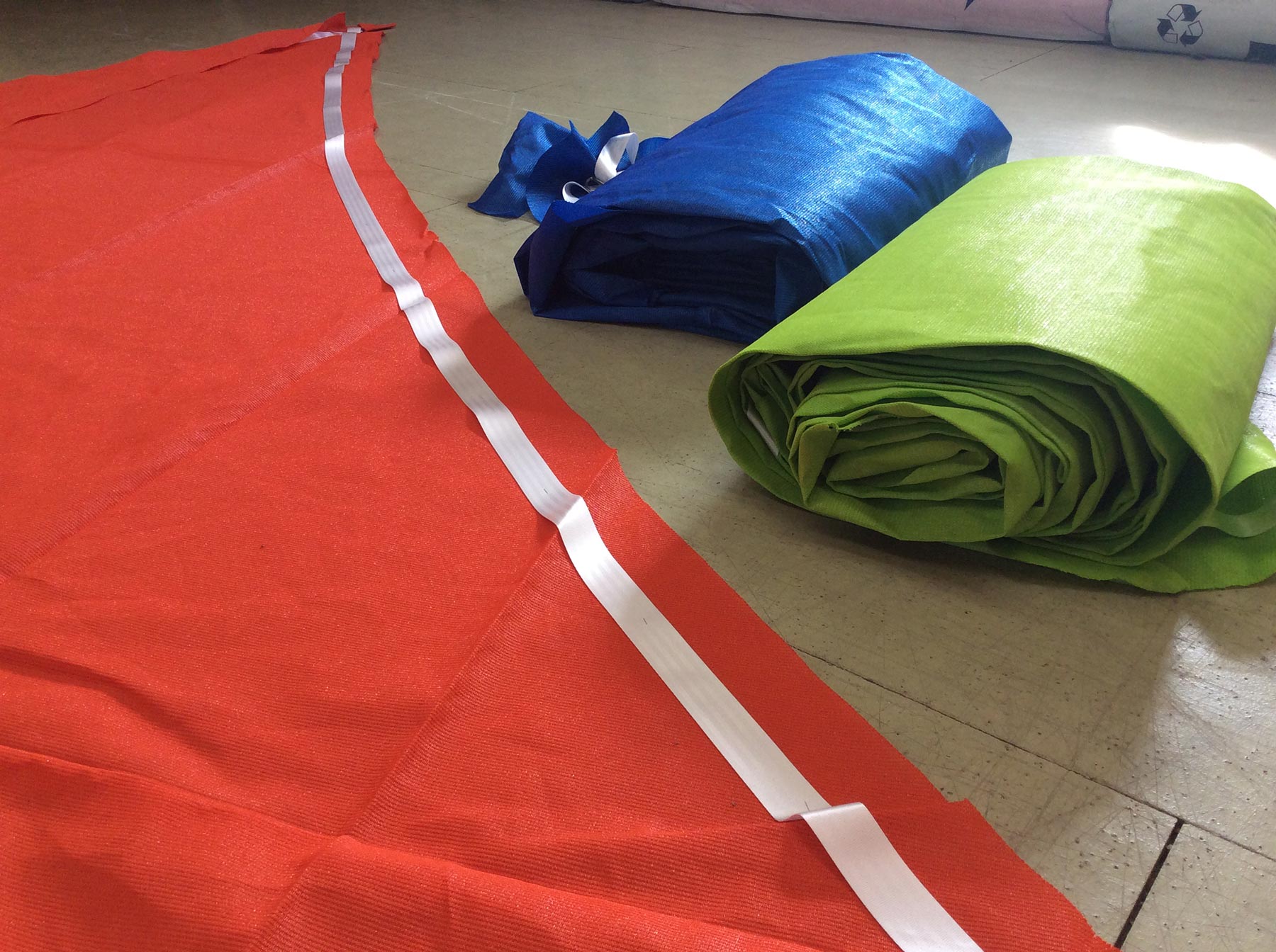 Orange Green Blue Shade sails being manufactured replacement shade sails Orange Green Blue Shade sails being manufactured replacement shade sails