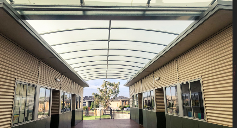 Triax Shade System installed as between portable classrooms