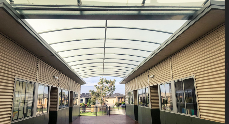 Triax portable classroom cover Triax Shade System installed as between portable classrooms