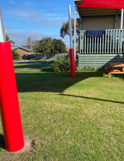 Red shade sail - red pole padding - outdoor learning - school safety padding - Mornington Peninsula School
