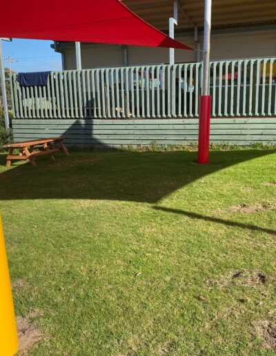 Red shade sail - yellow pole padding - outdoor learning - school safety padding - Mornington Peninsula School