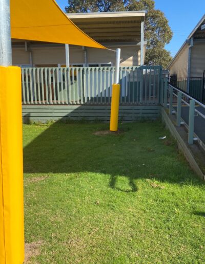 Yellow shade sail - yellow pole padding - outdoor learning - school safety padding - Mornington Peninsula School